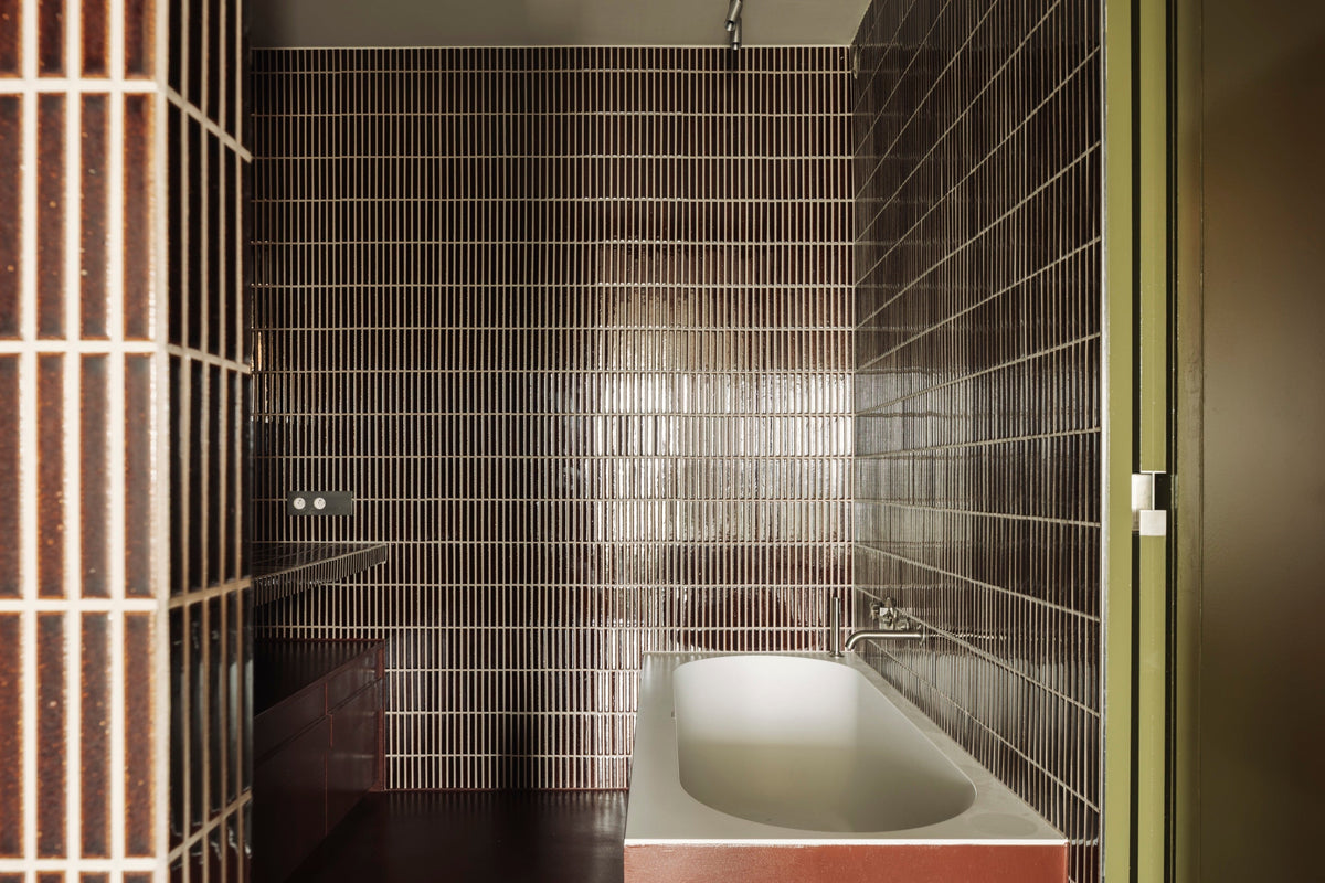 Kaji Border Burnt Russet tiles in a bathroom at a private penthouse in Knokke-Heist