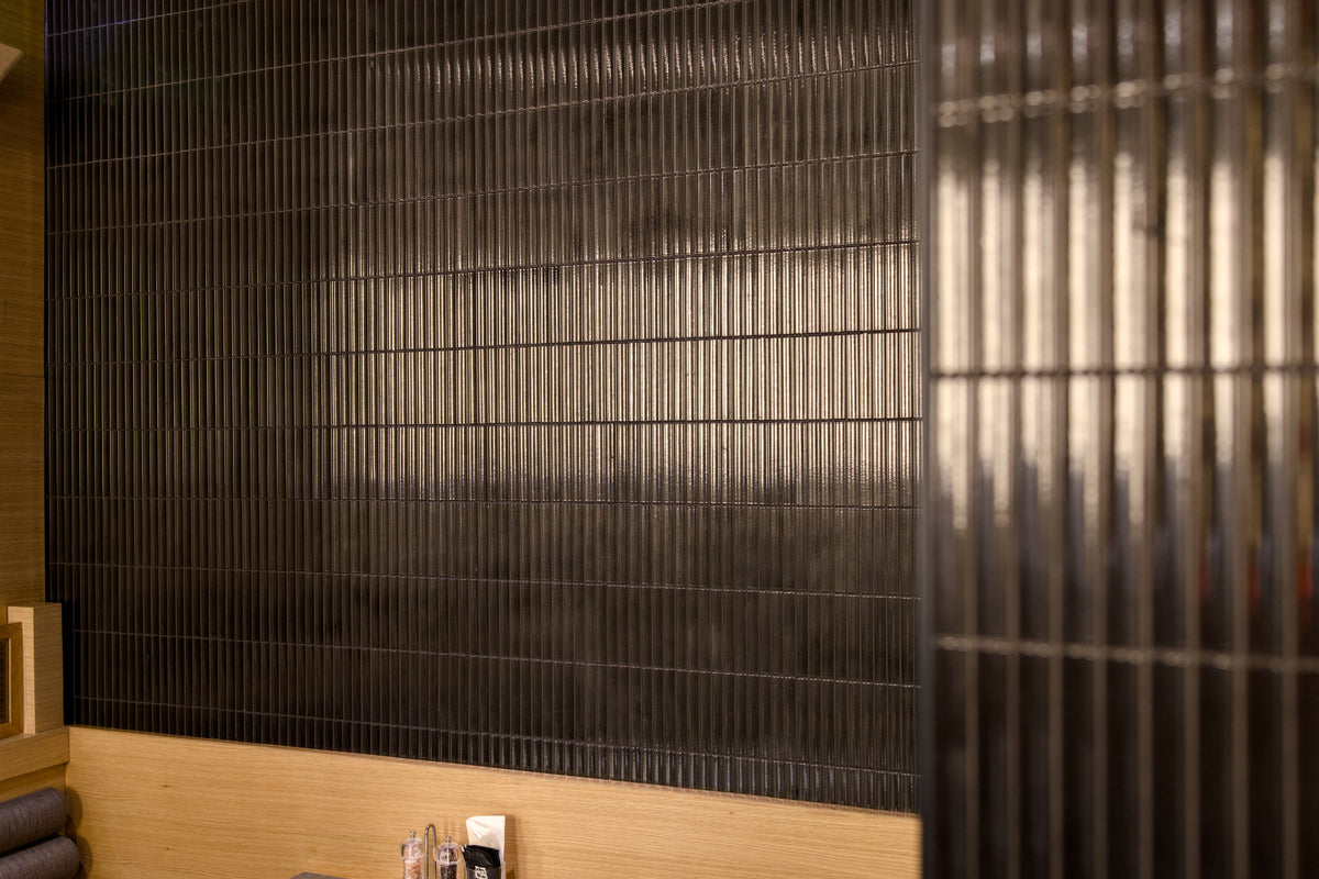Close detail of Yuki Border Speckled Black Japanese porcelain tiles