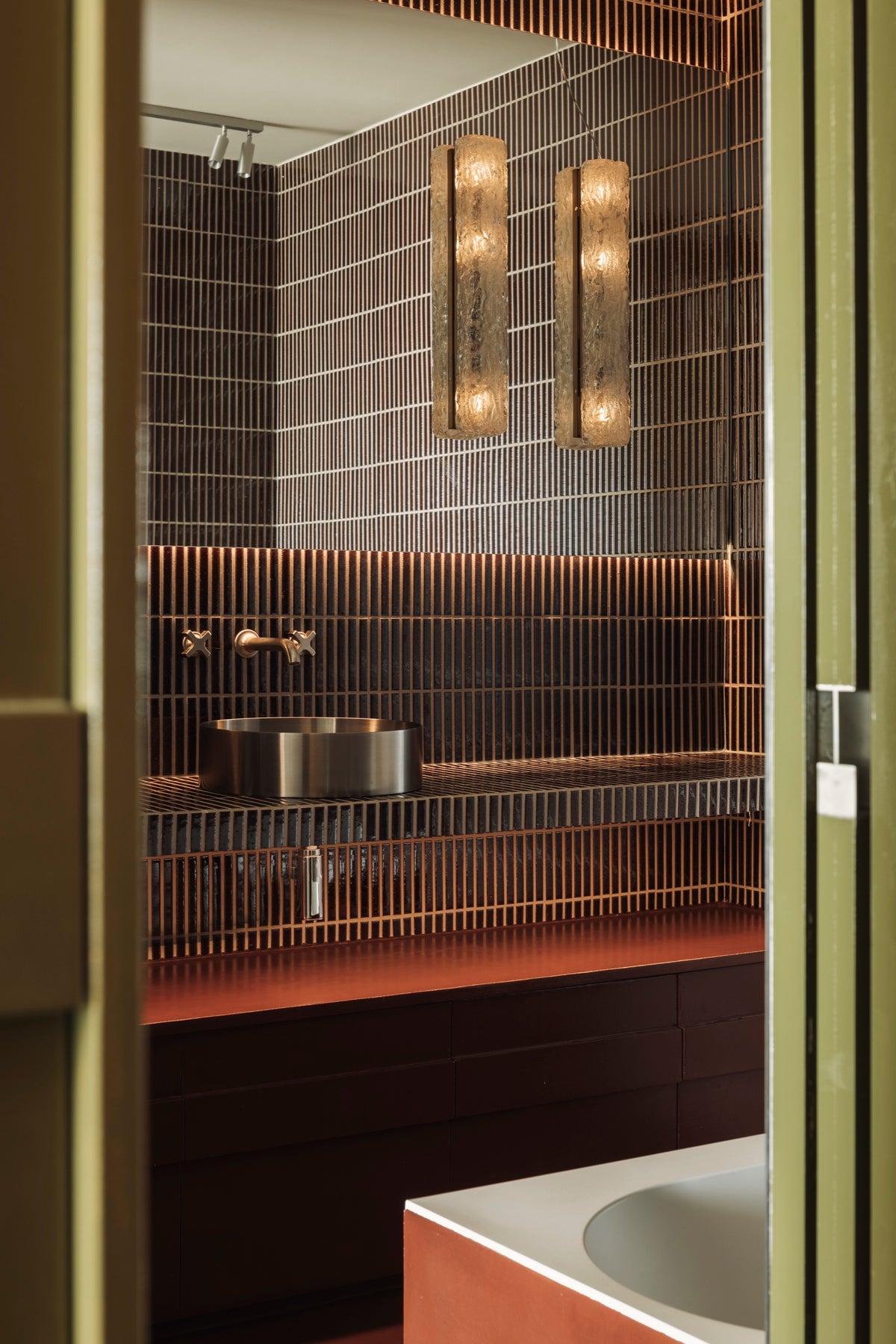 Kaji Border Burnt Russet bathroom tiles with warm reflected light