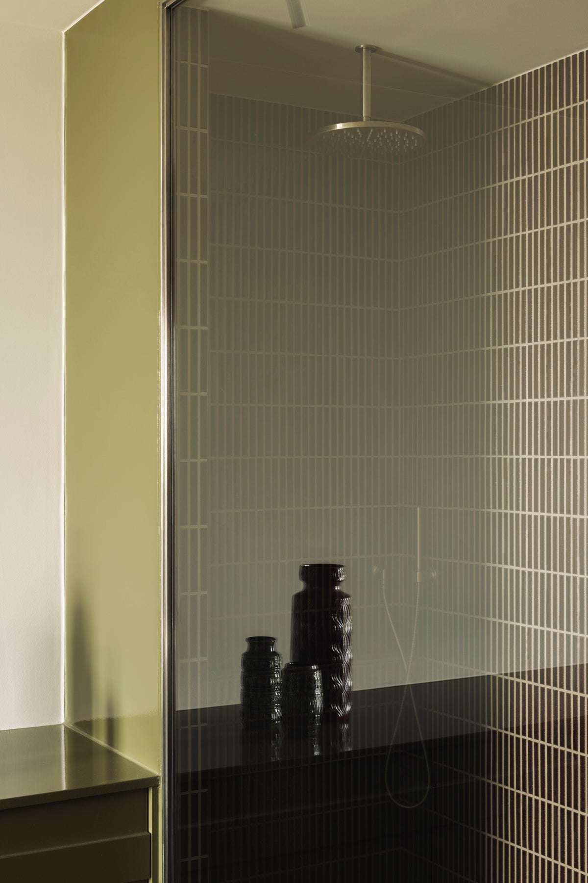 Kaji Border Vintage Green shower wall with dark fittings and glass