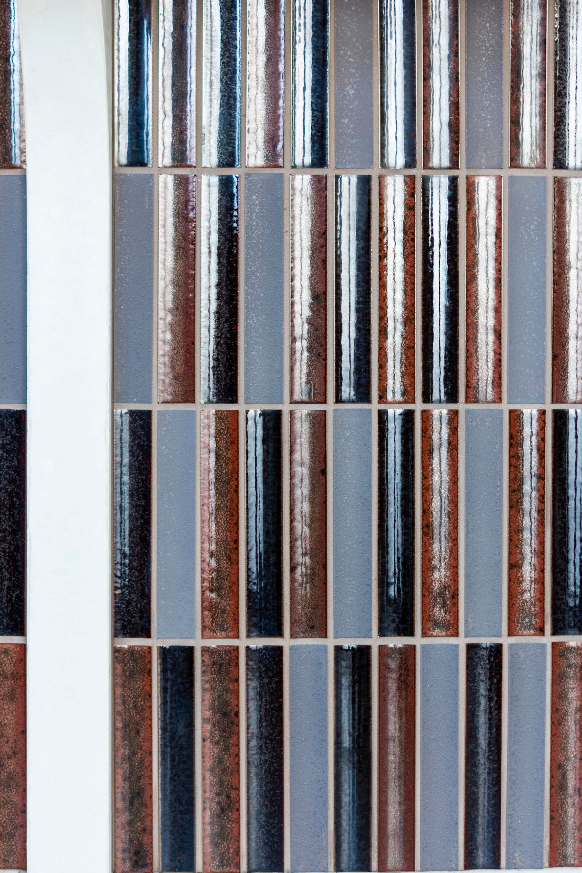 Close view of the varied Sairin Brown Mix glazed tile surface.