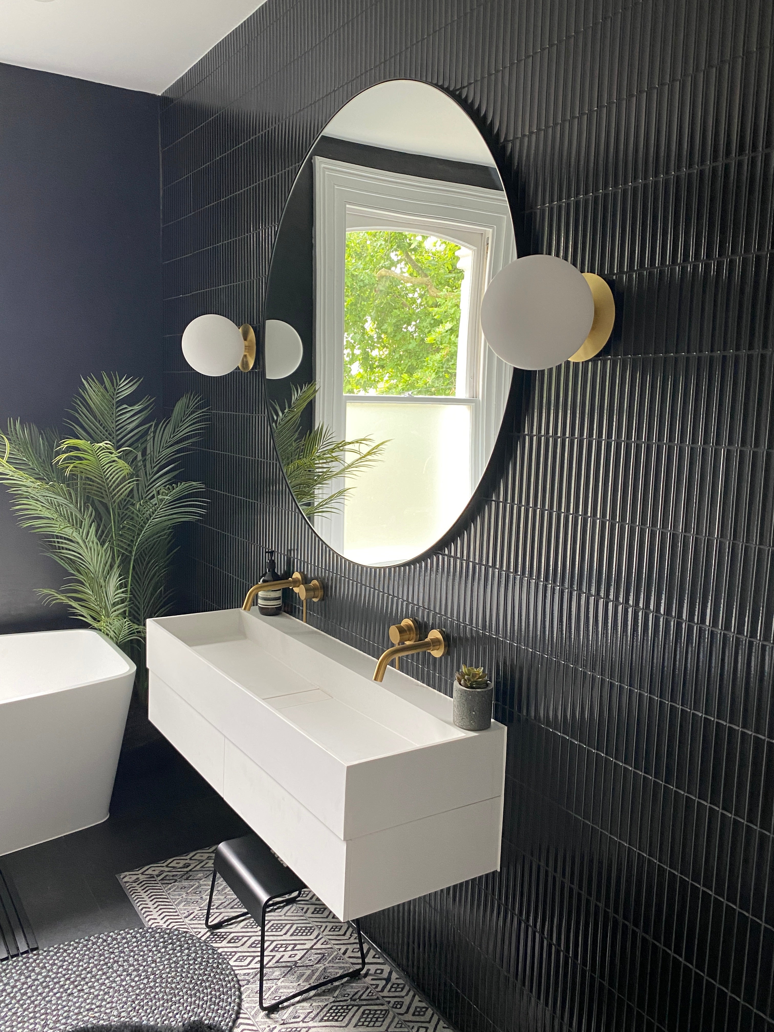 Yuki Border Speckled Black Japanese porcelain tiles in a private London bathroom