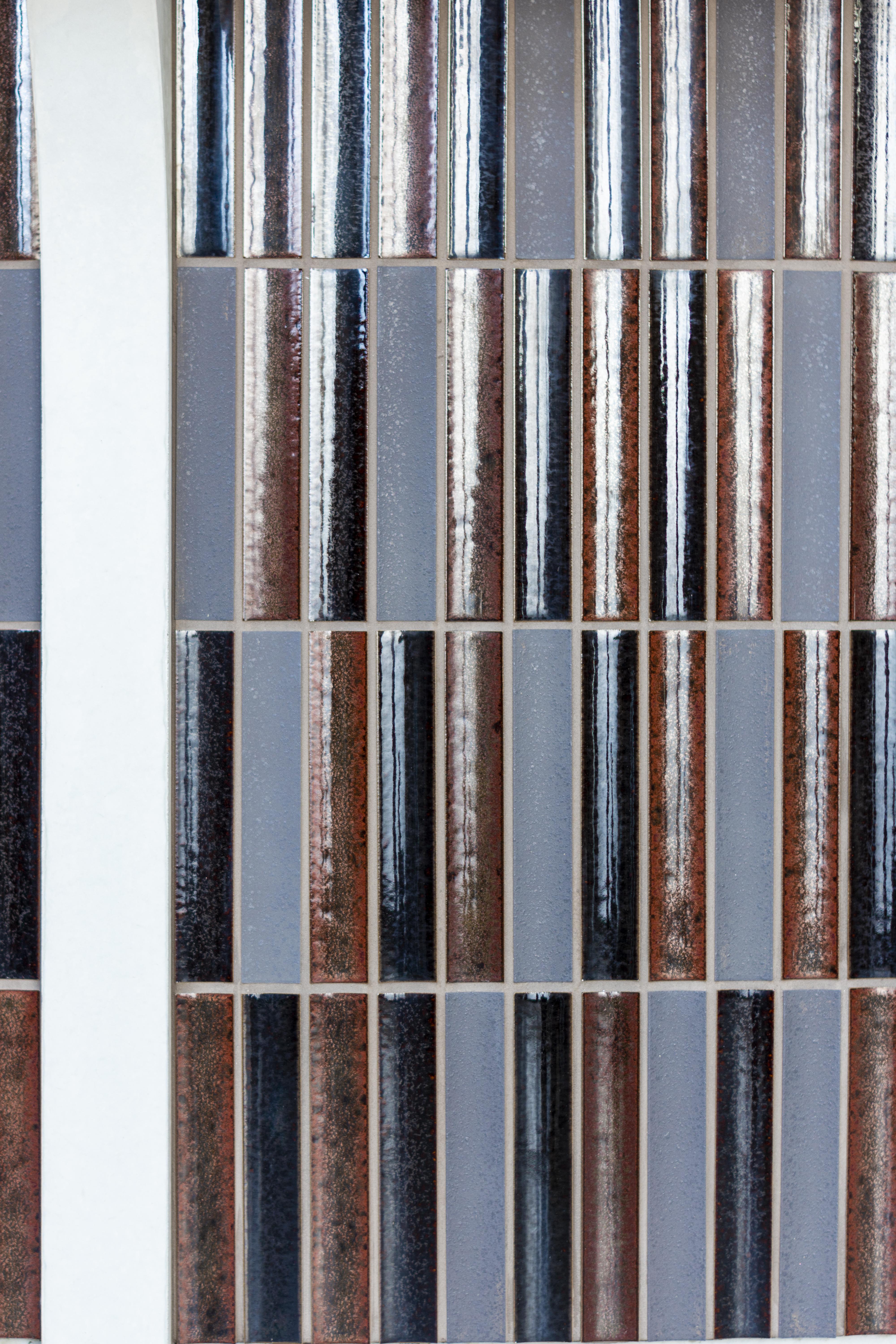 Close view of the varied Sairin Brown Mix glazed tile surface.