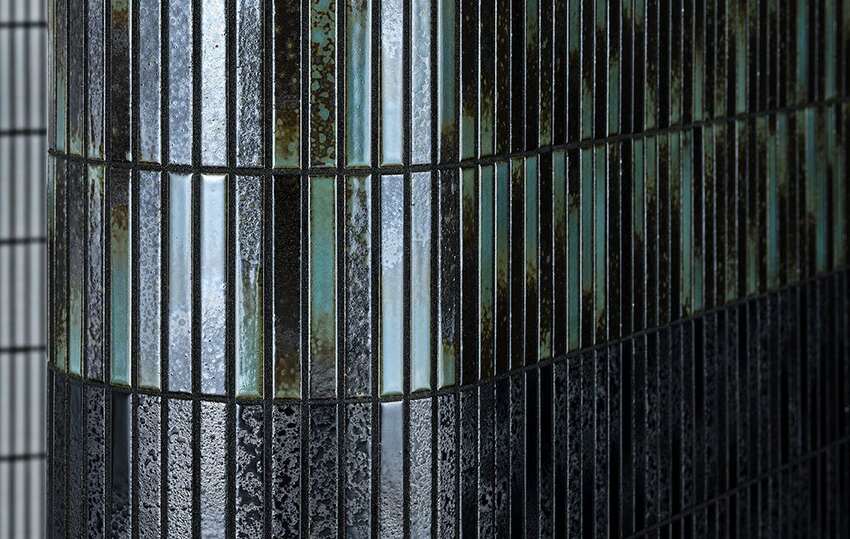 Installed textured glazed wall responding to light